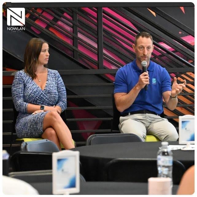 a photo of Tim and Maddie speaking at the event