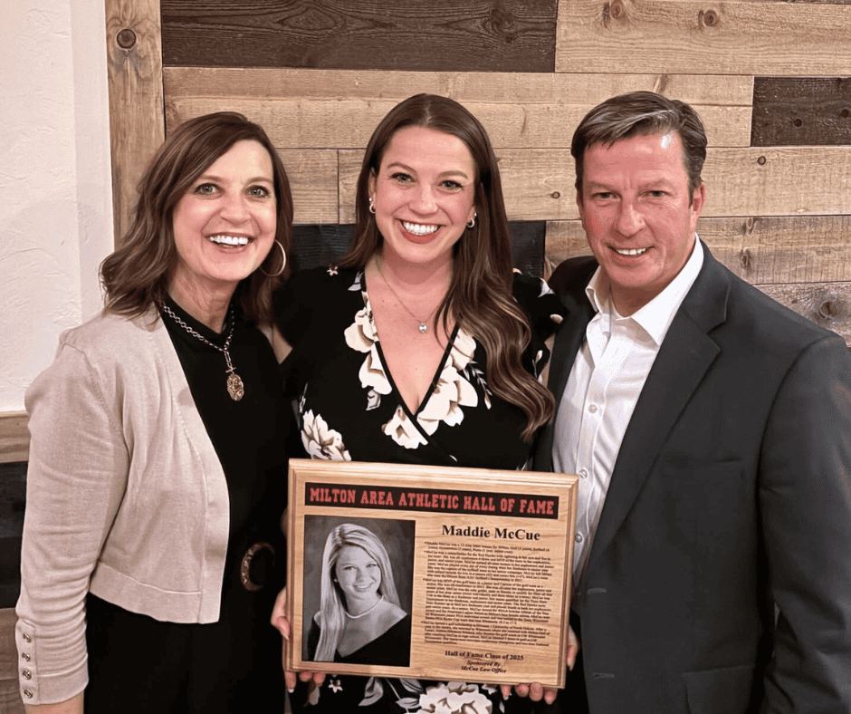 Maddie receiving her Hall of Fame awards with her parents